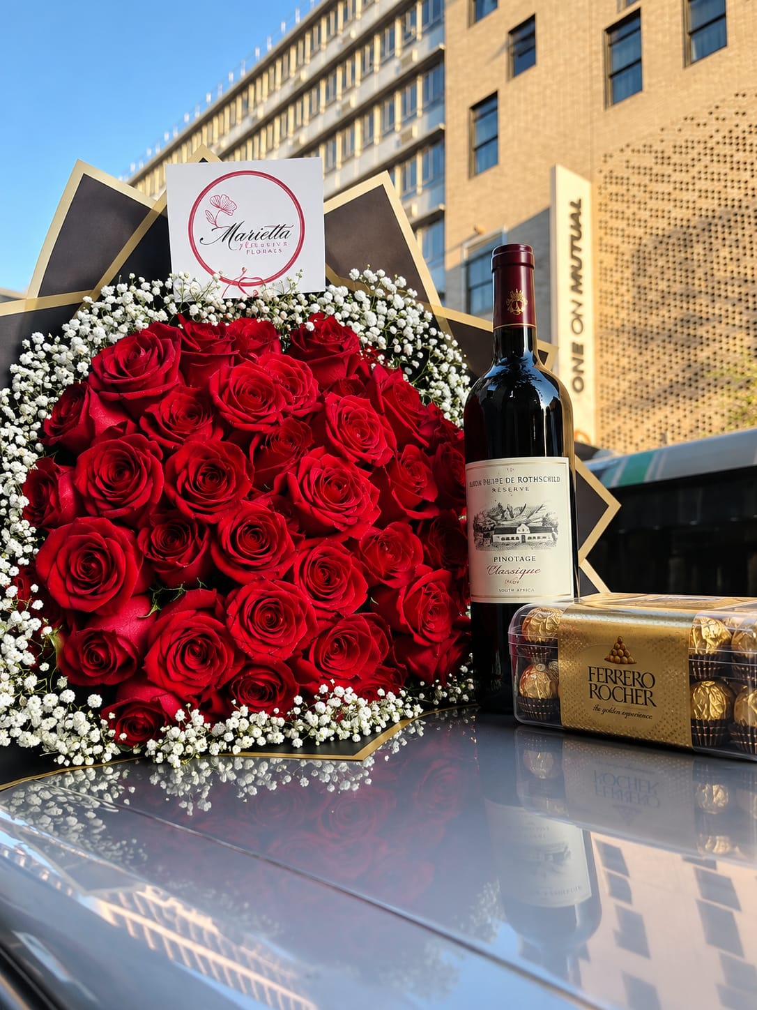 Celebration gift set with roses, wine and chocolates