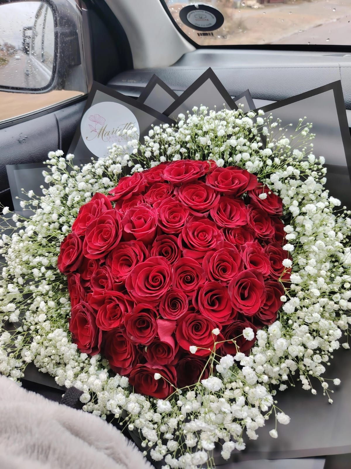 Red roses and gypsophila bouquet by Exclusive Florals